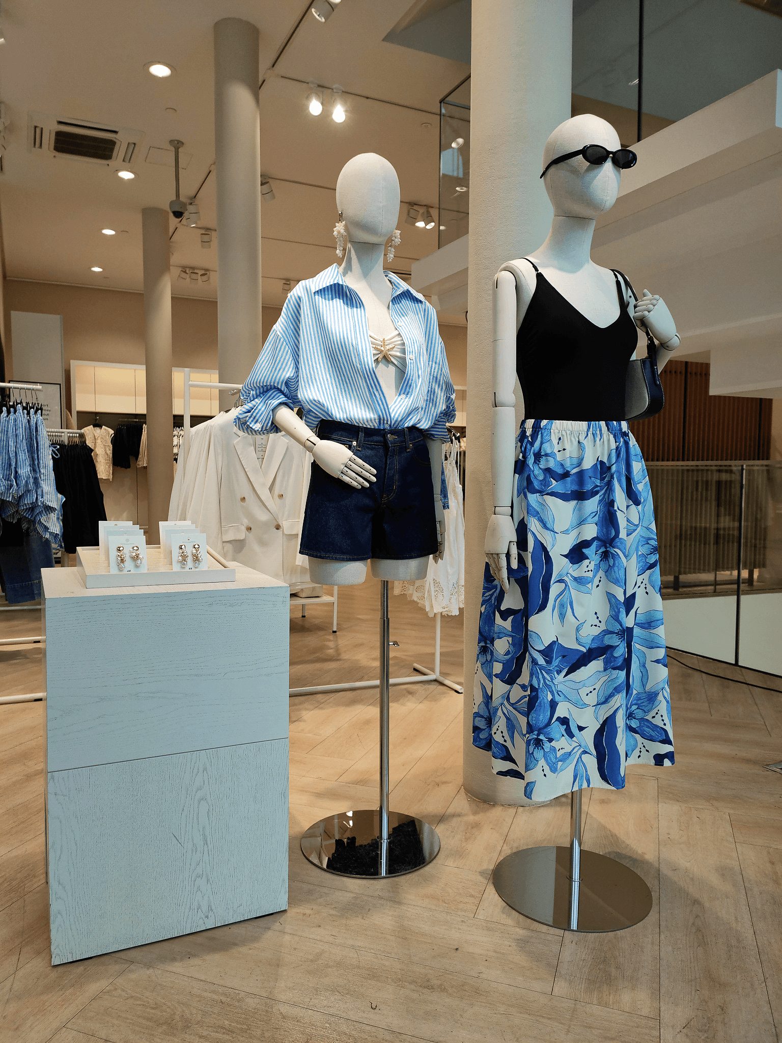 Spring Blue mannequins, striped blouse and blue floral skirt